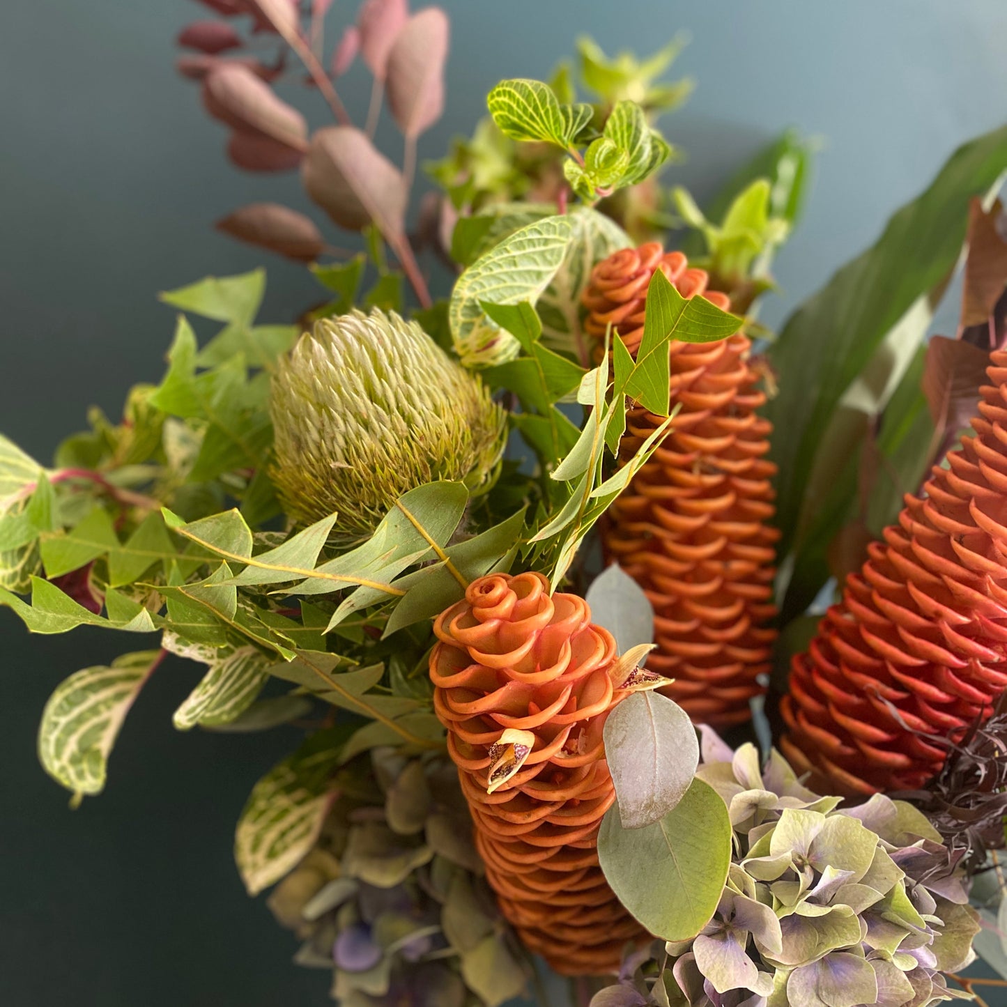 Ginger flowers, banksia and smokebush with lilac hydrangea arrangement