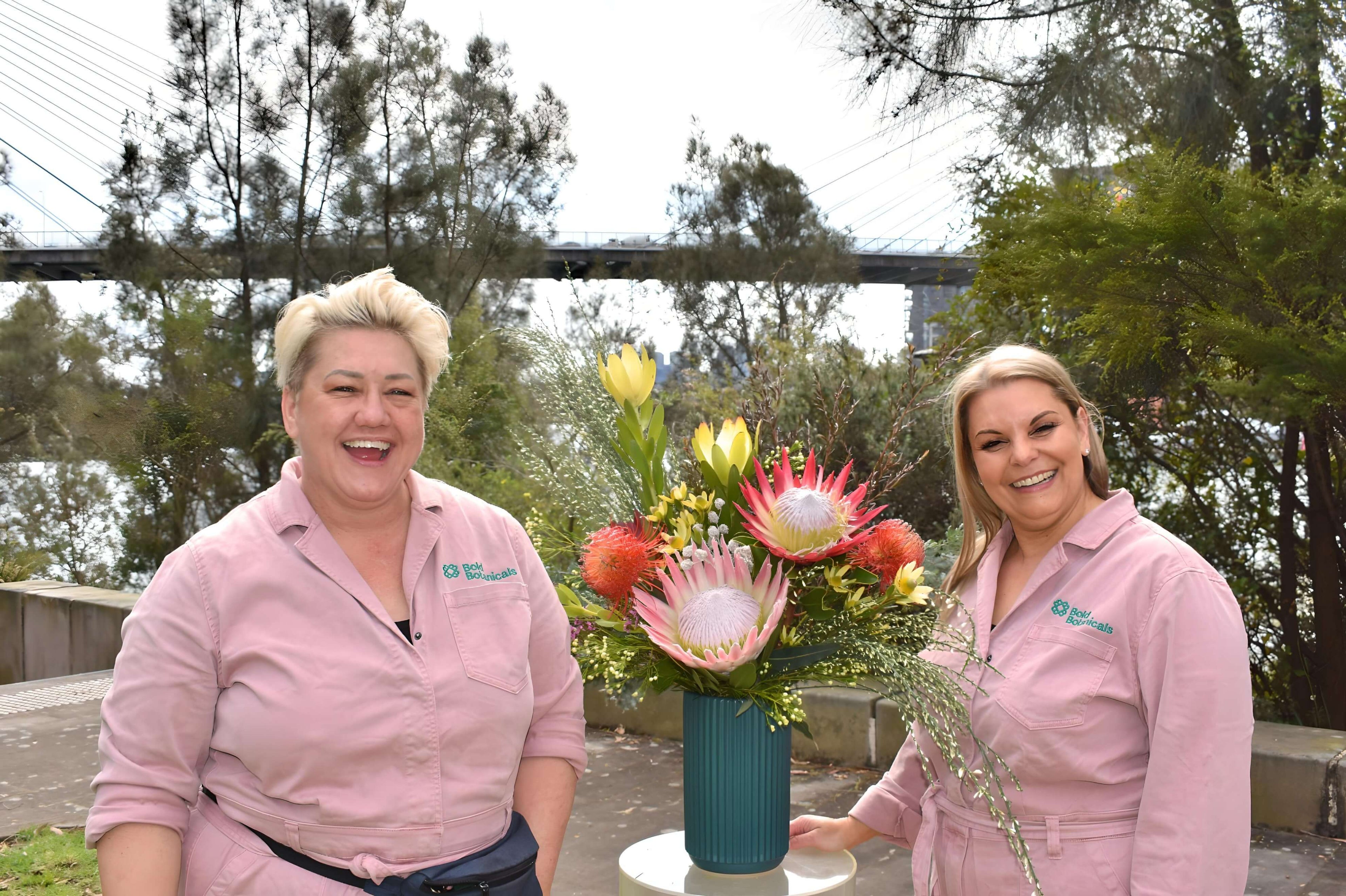 Suz and the Bod Botanicals team with a wedding flower arrangement