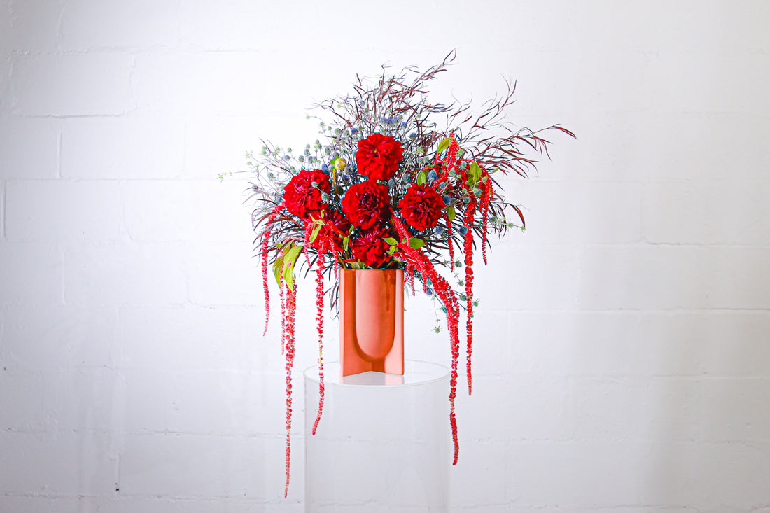 Bold Botanicals seasonal flowers in a vase featuring locally grownstriped roses