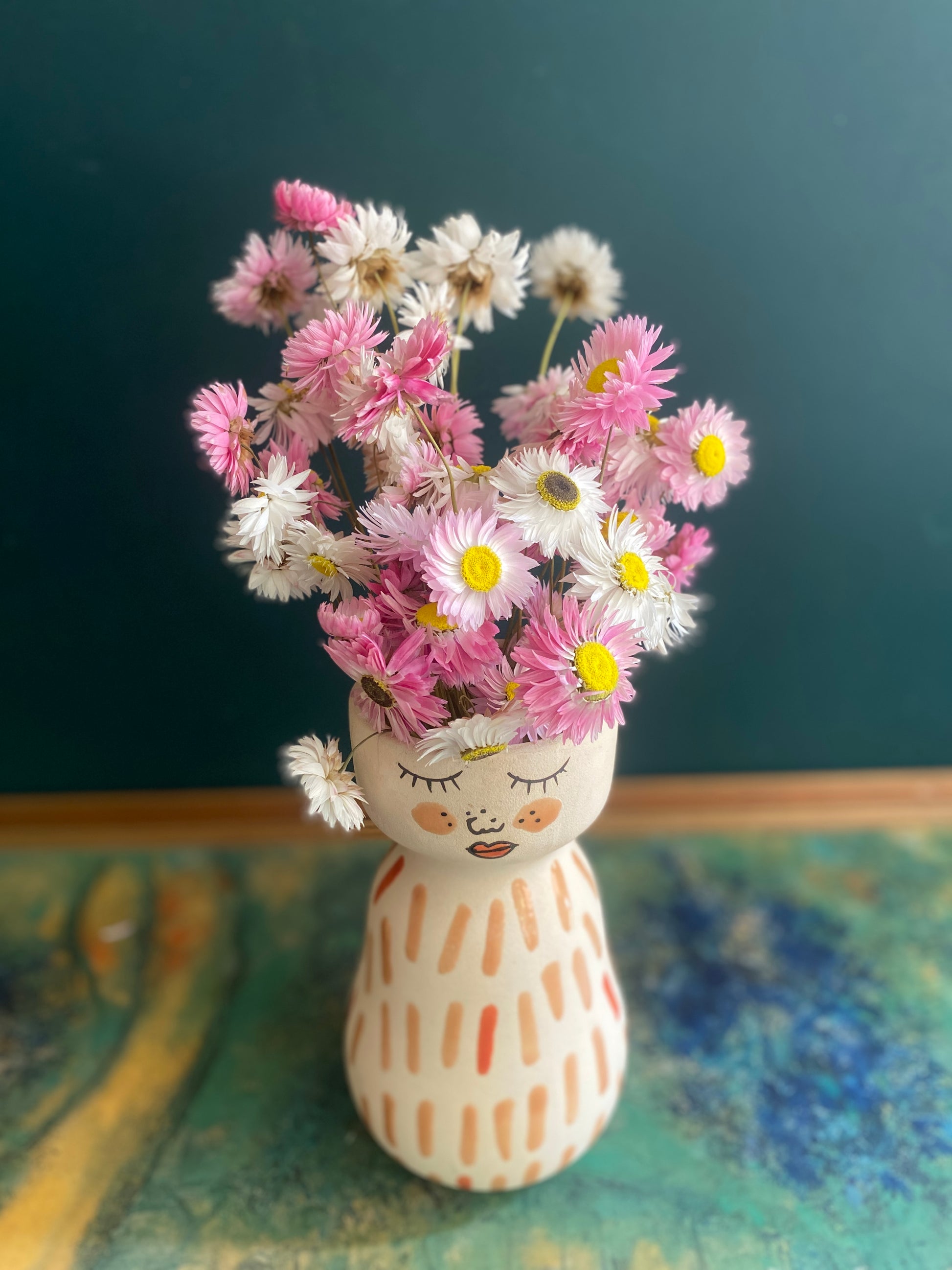 Pink dried daisies in Jones & Co vase
