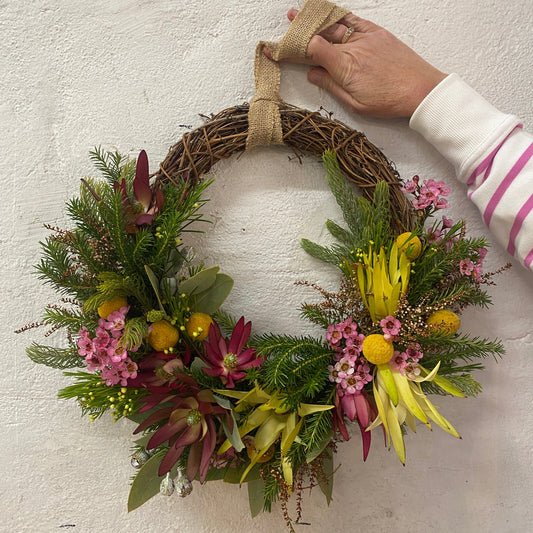 A 30cm Christmas wreath decorated with Australian native flowers 