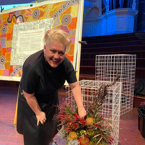 Suz from Bold Botanicals at the Sydney Peace Prize on stage with Australian native flowers