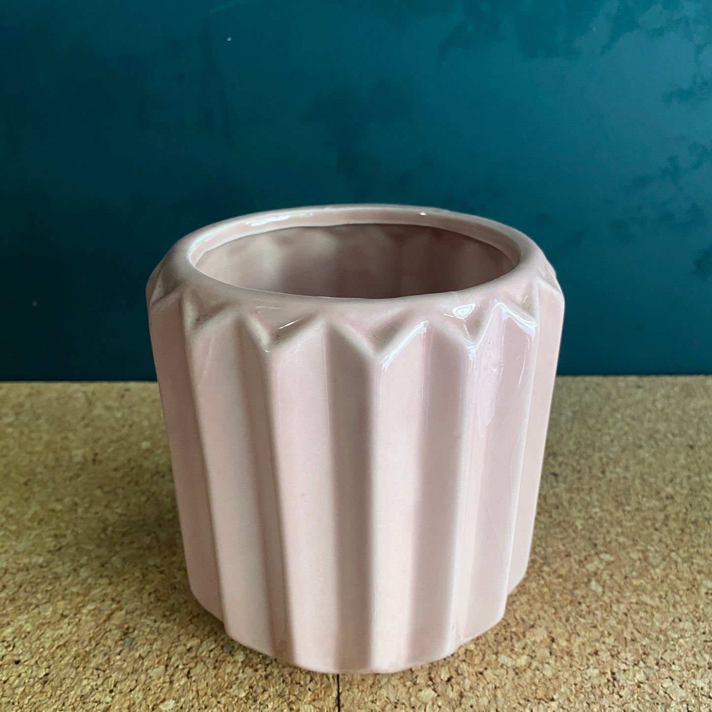 Round soft pink ceramic vase with geometric rib shape
