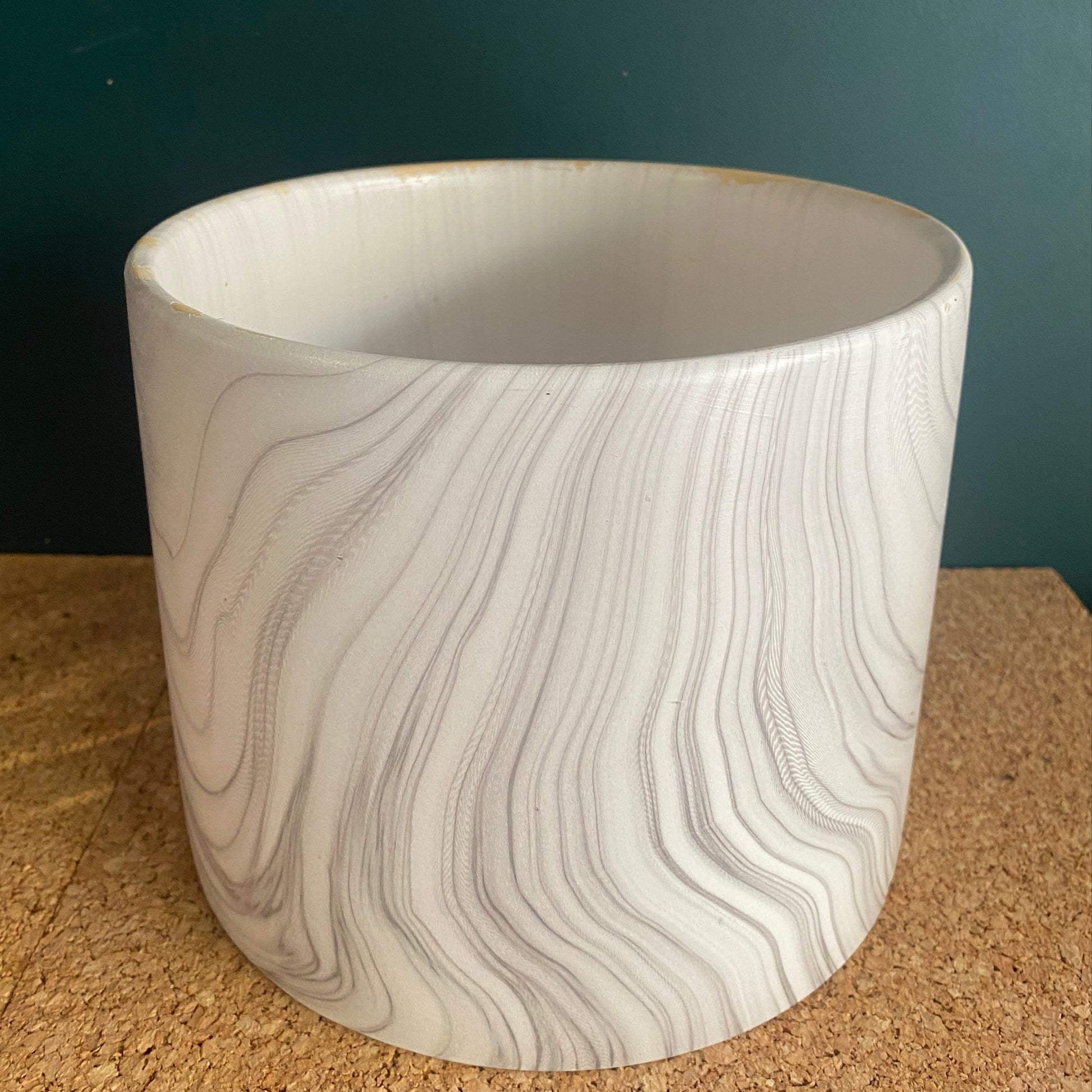 A white marble look finish on ceramic pot for plants or flower design