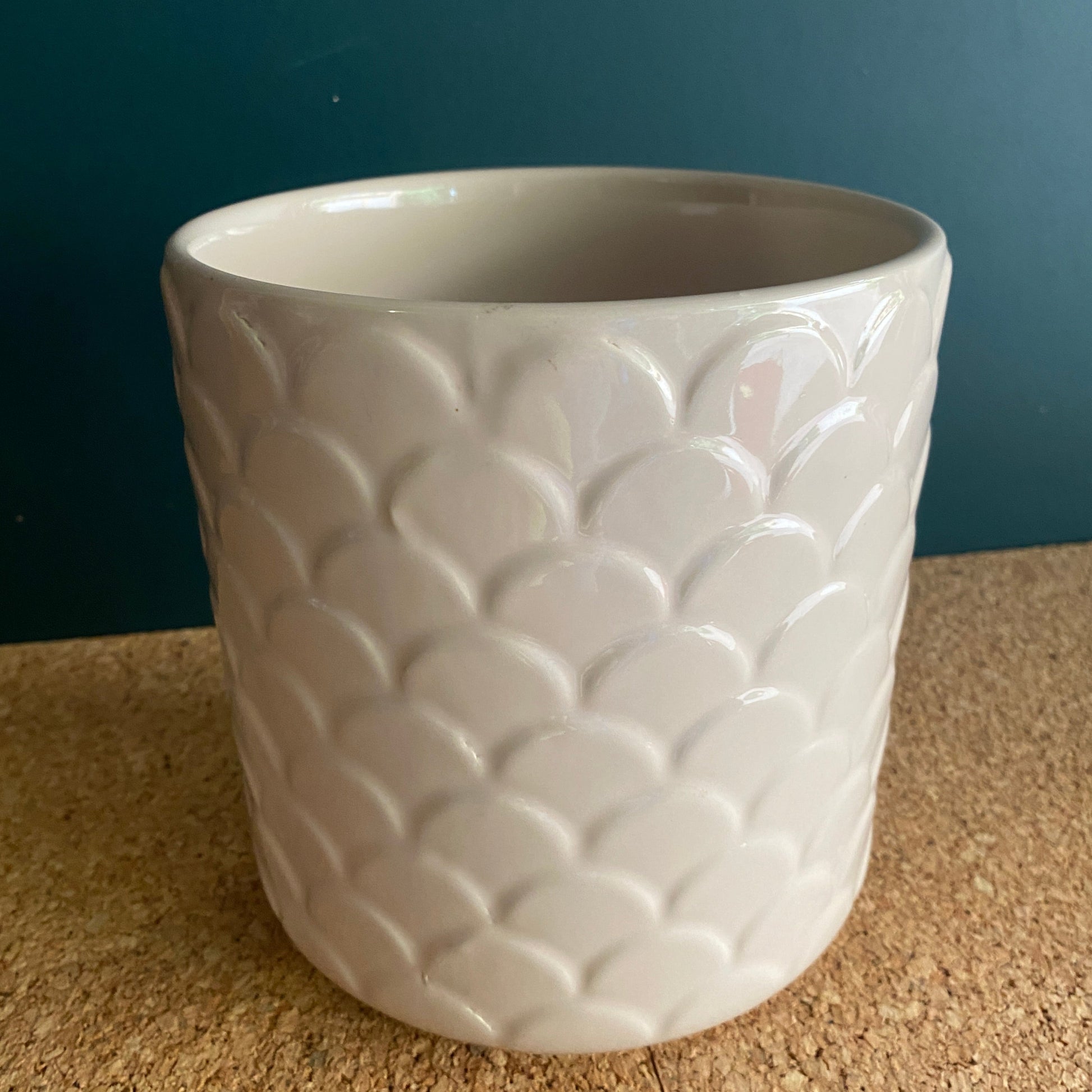 Soft pink gloss ceramic pot with a scalloped design texture