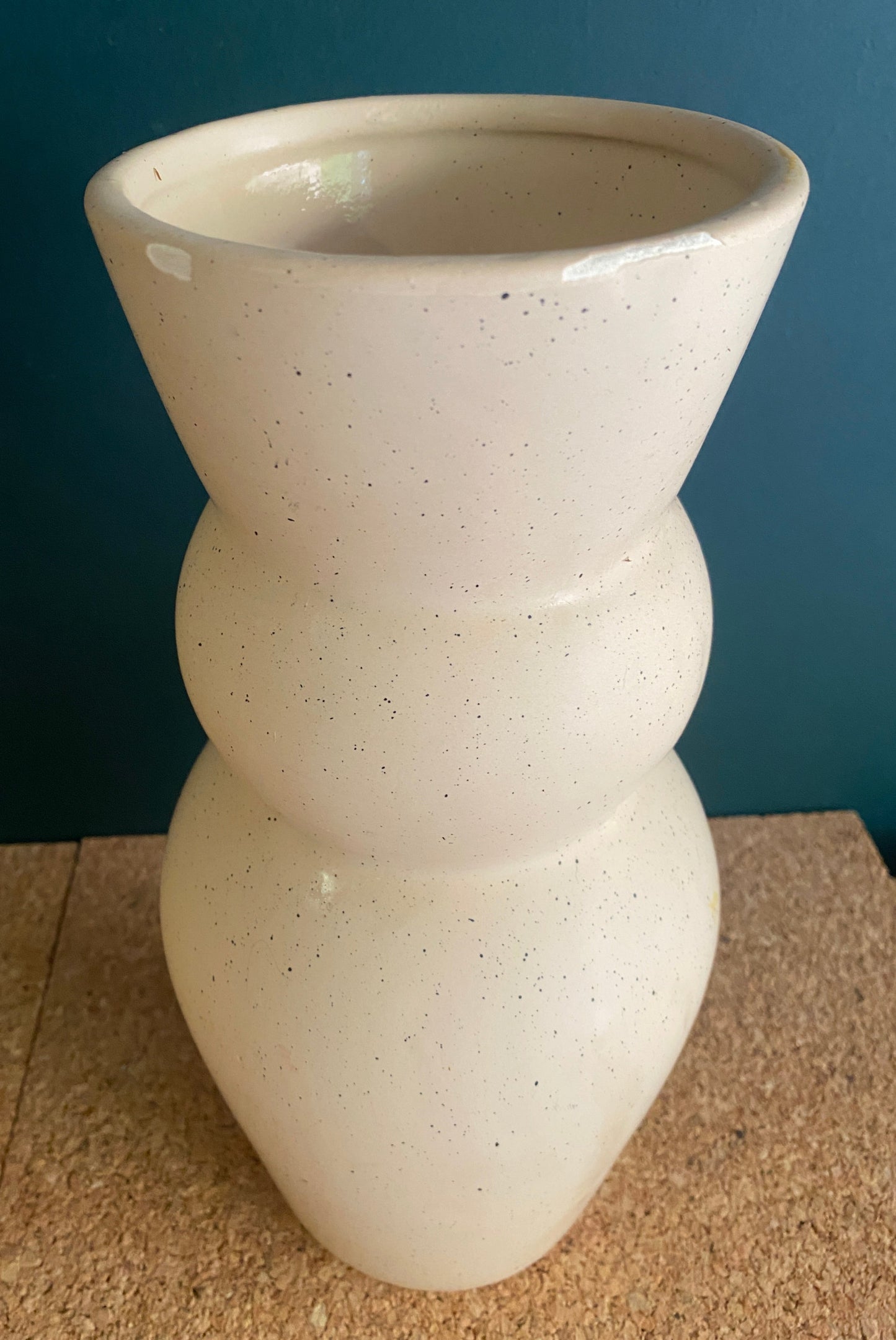 Tall curvy cream ceramic vase with speckle finish