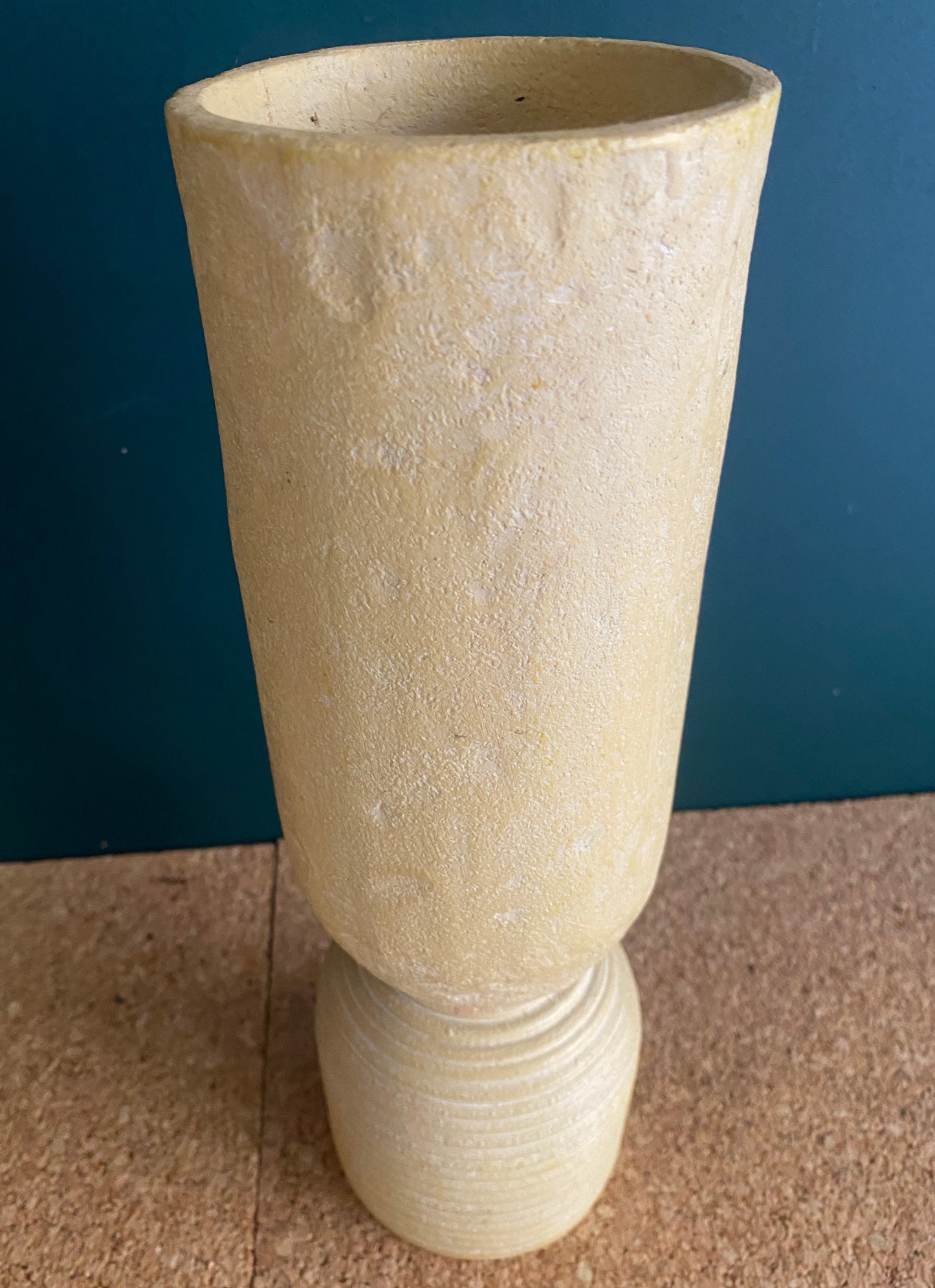 Tall earty texture vase with ribbed edge design