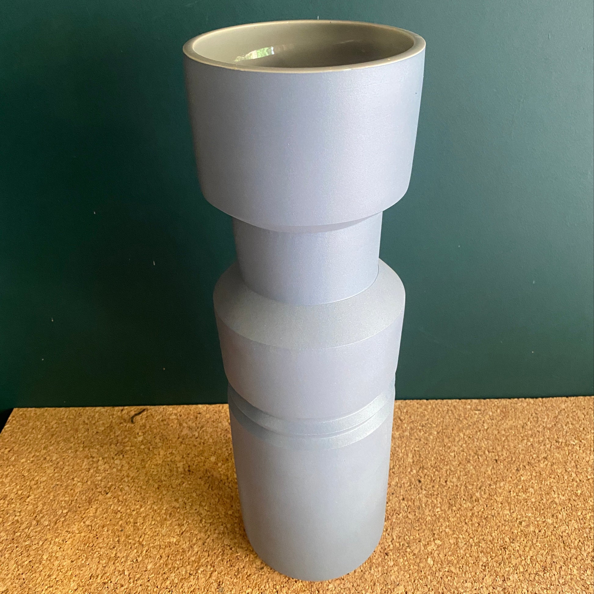A tall blue grey matt finish vase in style of Memphis design by Marmoset Found