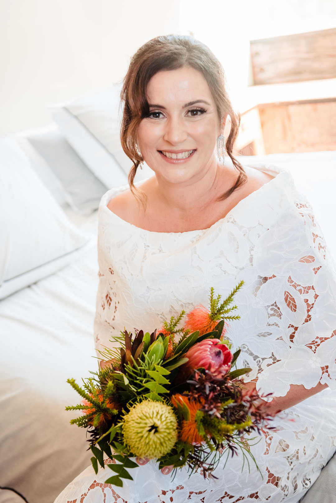 Beautiful bride holding a wedding bouquet of Australian native flowers arranged by Bold Botanicals