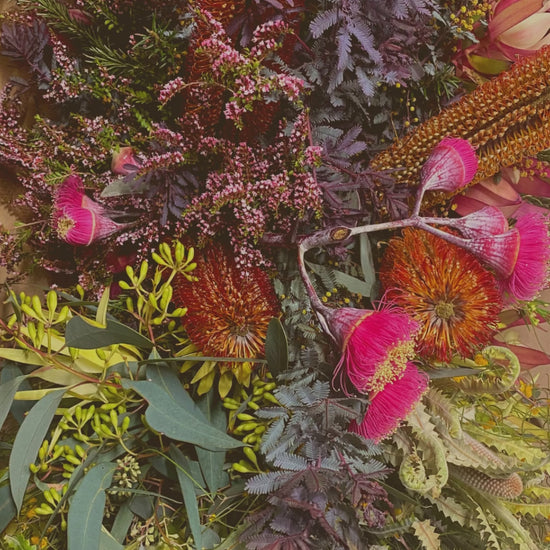 A tribute video showcasing stunning funeral flower designs for a casket.